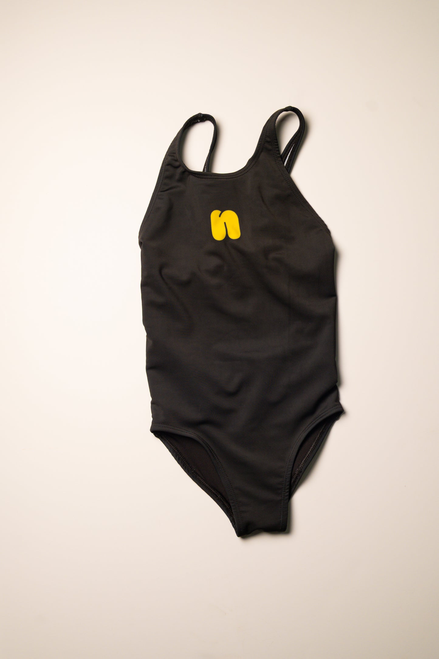 Traje de baño liso negro niña